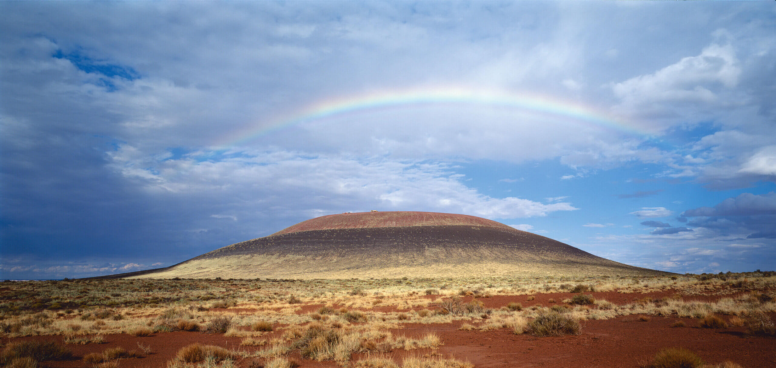 A rainbow over the desert